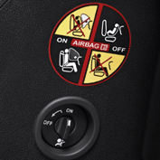 Front driver and passenger airbags which can be disabled using a key